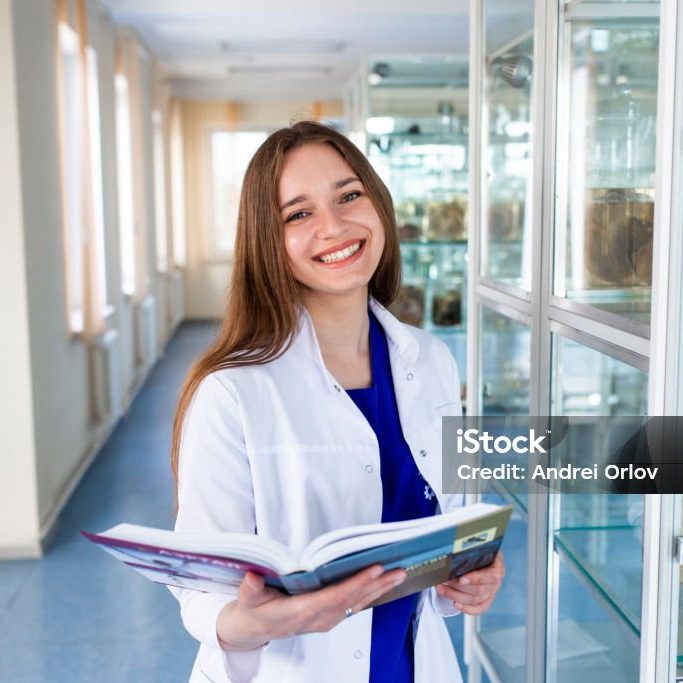 A student of the medical university in the anatomical museum. A future nurse in the office of a nursing school.